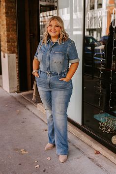 - Stay on top of the style game with this trendy jumpsuit! - Unlined stretchy denim material with subtle distressed detail - A collared neckline - Front zip closure - Short sleeves with rolled cuffs - Functional, chest, side, and back pockets - An elastic waistline with belt loops A hidden zip fly and button closure - A flattering silhouette that ends in straight hemlines Medium Wash Denim Jumpsuits And Rompers, Denim Jumpsuits And Rompers In Medium Wash, Fall Medium Wash Distressed Denim Jumpsuit, Trendy Jumpsuit, Hoodie Material, Denim Material, Denim Jumpsuit, Mens Shirt Dress, Unisex Style