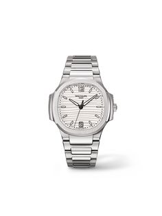 Patek Philippe offers a classic ladies’ Nautilus with date display in the form of the 7118/1A-001. The distinctive shape of the octagonal bezel is accentuated by 50 diamonds. The applied gold hour markers and numerals are color-coordinated with the stainless-steel case, which is water-resistant up to 6 bar and measures 33.6 x 8.7 millimeters. Operating behind the silver-and-white dial is a 324 S C self-winding caliber with a central rotor made of 21k gold. White Gold Watch With Date Display And Round Dial, Modern White Gold Watch With Date Indicator, White Gold Business Watches With Date Display, Business White Gold Watches With Date Display, White Gold Automatic Watch With Round Dial, Timeless Silver Chronograph Watch With Date Indicator, Timeless White Gold Watches With Date Indicator, White Gold Watch Accessories With Date Display, Patek Philippe Women