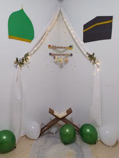 a room decorated with balloons, garlands and other items for an event or celebration