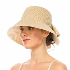 Washable and packable straw hat. Butterfly split cloche with downward sloping brim, 3.5" wide. Folded over straw bow in back. Ribbon inner band with drawstring to adjust size. Excellent UPF 50+ sun protection. Packable, travel friendly hat. Fold in half. Washable, handwash in cold water, lay flat or line to dry. One size, 57 cm. 80% polyester, 20% cotton