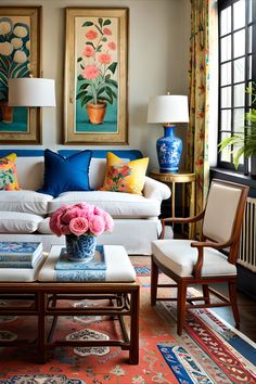 a living room filled with lots of furniture and flowers on top of a coffee table