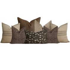 four pillows stacked on top of each other with different patterns and colors in the middle