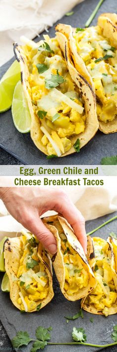 egg, green chile and cheese breakfast tacos on a tray with lime wedges