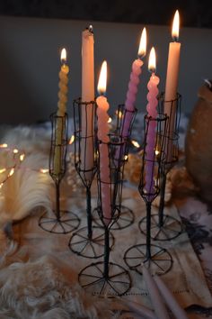 several lit candles sitting on top of a table