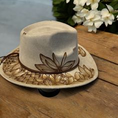 Short Brim Cowboy in Beige Burned using Pyrography Techniques with Freehand Art Hat is adjustable for a tighter fit on the inner crown. Each Hat made by PIPER comes with a Signature Dust/ Travel Bag and a Macrame wall Hat hanger. Hats are sealed for weather for up to 12 months. Adjustable Felt Cap For The Beach, Adjustable Felt Beach Cap, Beige Panama Hat With Curved Brim For Festivals, Adjustable Cream Hat With Curved Brim, Adjustable Beige Fedora With Curved Brim, Beige Fedora With Adjustable Curved Brim, Beige Brimmed Hat For Festivals, Beige Brimmed Festival Hat, Beige Short Brim Hat For Festival