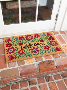 a welcome mat is on the front door