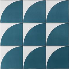 blue and white tiles with circular shapes in the same pattern on each tile, one is half - circle