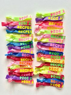 colorful ribbons with words written on them are arranged in the shape of rectangles