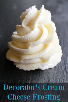 a stack of cream cheese frosting sitting on top of a black surface with the words decorator's cream cheese frosting