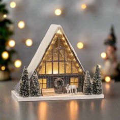 a christmas scene with a lit up house