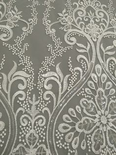 "This stunning Lace Fabric design piece has soft hand feel, It's perfect for weddings, bridal parties, and any events. Shop our large inventory of bridal fabrics. ☆PRODUCT DESCRIPTION : This gorgeous fabric is made on a sheer base with a beautiful vintage embroidery throughout. The fabric width is approximately 51\" (130cm) Wide. Color: off-white or beige as in picture Material: Rayon, Polyester，Sequins ☆ PURCHASING INFORMATION: This fabric is sold by the yard and each Qty you enter will represe Traditional Machine Embroidered Fabric For Wedding, Silver Embroidered Gown For Wedding, White Sequin Fabric With Intricate Embroidery For Festive, Elegant Machine Embroidered Fabric For Wedding, Embroidered Lace Gown For Reception, Festive White Sequin Fabric With Intricate Embroidery, Reception Lace Embroidered Gown, Reception Gown With Embroidered Lace, White Wedding Dress With Intricate Embroidery For Reception