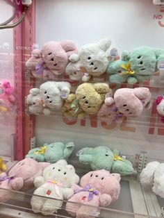 there are many stuffed animals on display in the store