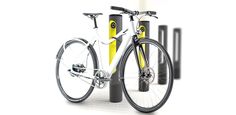 a bike is parked next to some poles and poles with yellow wheels on them,