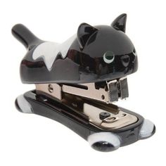 a black and white cat shaped stapler