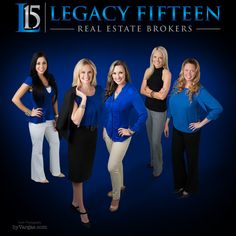 five women in blue and black posing for a real estate advertiser's photo