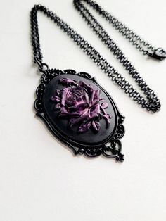 JUST LISTED Purple Iridescent Rose Gothic Rockabilly Cameo Black Necklace Pendant Victorian Jewelry Hand painted cameo If you are wanting a specific color of roses please feel free to contact me and I will do my best to create what you are searching for. Victorian Jewelry substantial in size at just a little over 2 INCHES Long Center is 40mmx30mm **MATCHING ITEMS IN OUR STORE BADGE HOLDER BROOCH HAIR PINS - CLIPS** **thank you for taking the time to look at our items. Each item is handcrafted an Color Of Roses, Gothic Rockabilly, Jewelry Hand, Black Necklace, Victorian Jewelry, Badge Holder, Badge Holders, Matching Items, Necklace Pendant