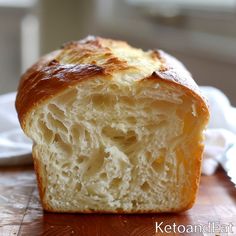 a loaf of bread sitting on top of a wooden table