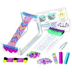 an assortment of crafting supplies including scissors, beads and glue on a white background