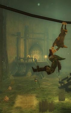 two people are hanging upside down in the air above a green area with stairs and other items