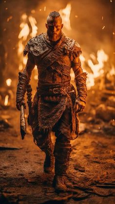 a man in armor is walking through the fire