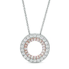 Increase the sparkle factor with this glimmering double-circle pendant. Crafted in sterling silver and precious 10K rose gold, this mesmerizing style impresses with an inner rose gold open circle and an outer silver circle outline - both shimmering with petite lab-created white sapphires. Polished to a bright shine, this pendant suspends along an 18.0-inch rope chain that secures with a spring-ring clasp.