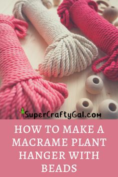 yarn wrapped in pink and white with the words how to make a macrame plant hanger with beads