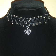 Thick Tattoo Choker Style Necklace With Beads Heart Charm Handmade With Love Stretch To Fit Perfect For Valentines Day Same Day Or Next Day Shipping Please Feel Free To Ask For Any Details/ Measurements Everything I List Is Cross Posted On Other Platforms, Snag It Before It's Gone Stay Blessed, Stay Safe. Shopsaritalynne Black Heart Charm Choker For Valentine's Day, Adjustable Black Choker With Heart Charm, Metal Choker With Black Beads For Gift, Metal Choker With Black Beads As A Gift, Black Beads Metal Choker As Gift, Black Beaded Metal Choker Gift, Black Heart Pendant Choker With Heart Charm, Black Heart Pendant Choker With Charm, Black Heart-shaped Metal Choker