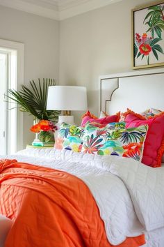 an orange and white bed in a bedroom