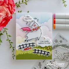 a card with some flowers and markers on it