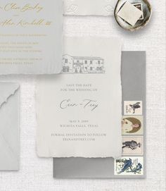 the wedding stationery is laid out on top of each other, with stamps and envelopes