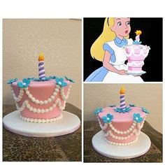 there is a pink cake decorated with pearls and a candle