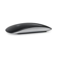 a computer mouse sitting on top of a white surface