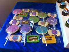 a table topped with lots of colorful lollipops on top of each other