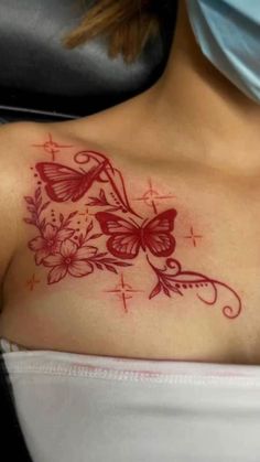 a woman with a butterfly tattoo on her chest