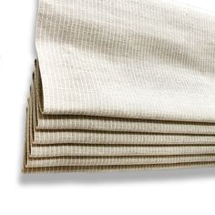 four pieces of white linen folded on top of each other