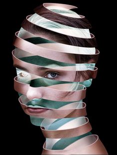 a woman's face is covered in strips of tape