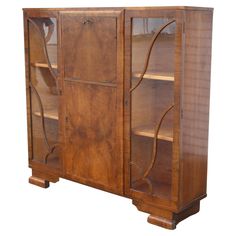 an old wooden cabinet with glass doors