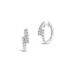 Modern sparkle. Add an elegant edge to any ensemble with these dainty crossover huggie earrings. Round diamonds and beaded gold give this pair texture, sparkle, and all the style. -18K gold weighing 2.87 grams -10 round diamonds totaling 0.19 carats Available in yellow, white, and rose gold. Please allow 4-6 weeks for delivery if item is not in stock. Item no. E10449 Diamond Signet Ring, Elephant Pendant Necklace, Bali Earrings, Diamond Heart Pendant Necklace, Earrings Round, Bezel Set Diamond, Elephant Pendant, Heart Pendant Diamond, Diamond Hoop Earrings