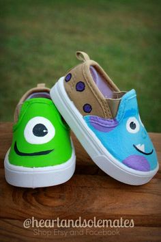 two children's shoes with faces painted on them