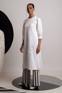 Ivory handwoven cotton round neck kurta with floral thread embroidery. Paired with striped flared pant. - Aza Fashions Off White Straight Kurta For Spring, White Linen Fitted Kurta, White Fitted Linen Kurta, White Handloom Cotton Kurta, Fitted White Handloom Kurta, White Cotton Kurta With Relaxed Fit, White Cotton Relaxed Fit Kurta, White Relaxed Fit Cotton Kurta, White Kurta For Spring Daywear