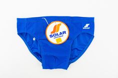 Vintage swimwear - Solar Made in W-Germany 1980s Athletic swim brief in mid blue color. Sporty fit. High waisted. Shiny texture. White Solar logo on left front . Elastic waist with lace. Lined on front . Label inside. In very good condition. Deadstock item with its authentic cardbord label and/or stickers. 86% Polyamide 14% Elasthan Size:  5-M          Measurements (flat):  Waist: 31cm to 43cm - 12,2" to 16,9"  Leg opening: 20cm - 7,8" Crotch front: 27cm - 10,6" Crotch back: 23cm - 9" Side: 6cm Blue Briefs For Water Polo, Retro Blue Bottoms For Poolside, Retro Blue Swim Bottoms, Retro Blue Swimming Bottoms, Retro Blue Swimwear For Swimming, Solar Logo, 1980s Men, Athletic Swim, Vintage Swim