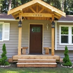 the front porch of a house with steps leading up to it and a wooden door