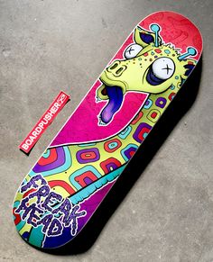 a skateboard with an image of a giraffe on it's side