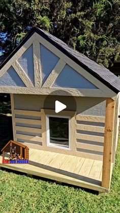 a small dog house made out of wood with a porch and windows on the side