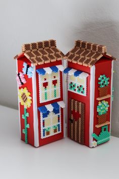 a red and white house made out of legos