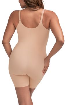 Comfortable, targeted compression sculpts the tummy, thighs and back in this shaping bodysuit that creates a smooth look under clothes. Medium compression V-neck Adjustable, convertible straps Open gusset Removable soft cups 64% nylon, 34% spandex Hand wash, dry flat Imported Shaping Bodysuit, Body Hugging Dress, Slim Shapewear, Vegan Leather Leggings, Cami Bodysuit, High Waisted Briefs, Tank Bodysuit, Under Dress, Clothes Ideas