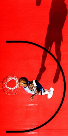 a basketball player is going to dunk the ball in front of an overhead view