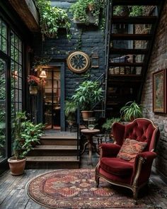 a living room filled with furniture and lots of plants