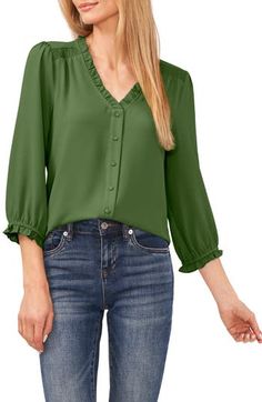 Frilly ruffles trim the neckline and cuffs of a breezy button-front blouse with three-quarter sleeves and smocked panels at the shoulders. 23" length (size Medium) Front button closure V-neck Three-quarter sleeves 98% polyester, 2% spandex Machine wash, tumble dry Imported Blouse Nordstrom, Clover Green, V Neck Blouse, Three Quarter Sleeves, Ruffle Trim, Ruffles, Nordstrom, V Neck, Color