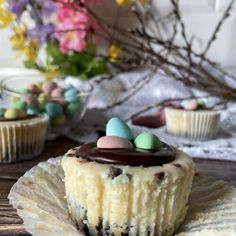 cupcakes with chocolate frosting and candy eggs on top